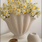 handmade white ceramic vase with sculptural seashell design for modern interiors