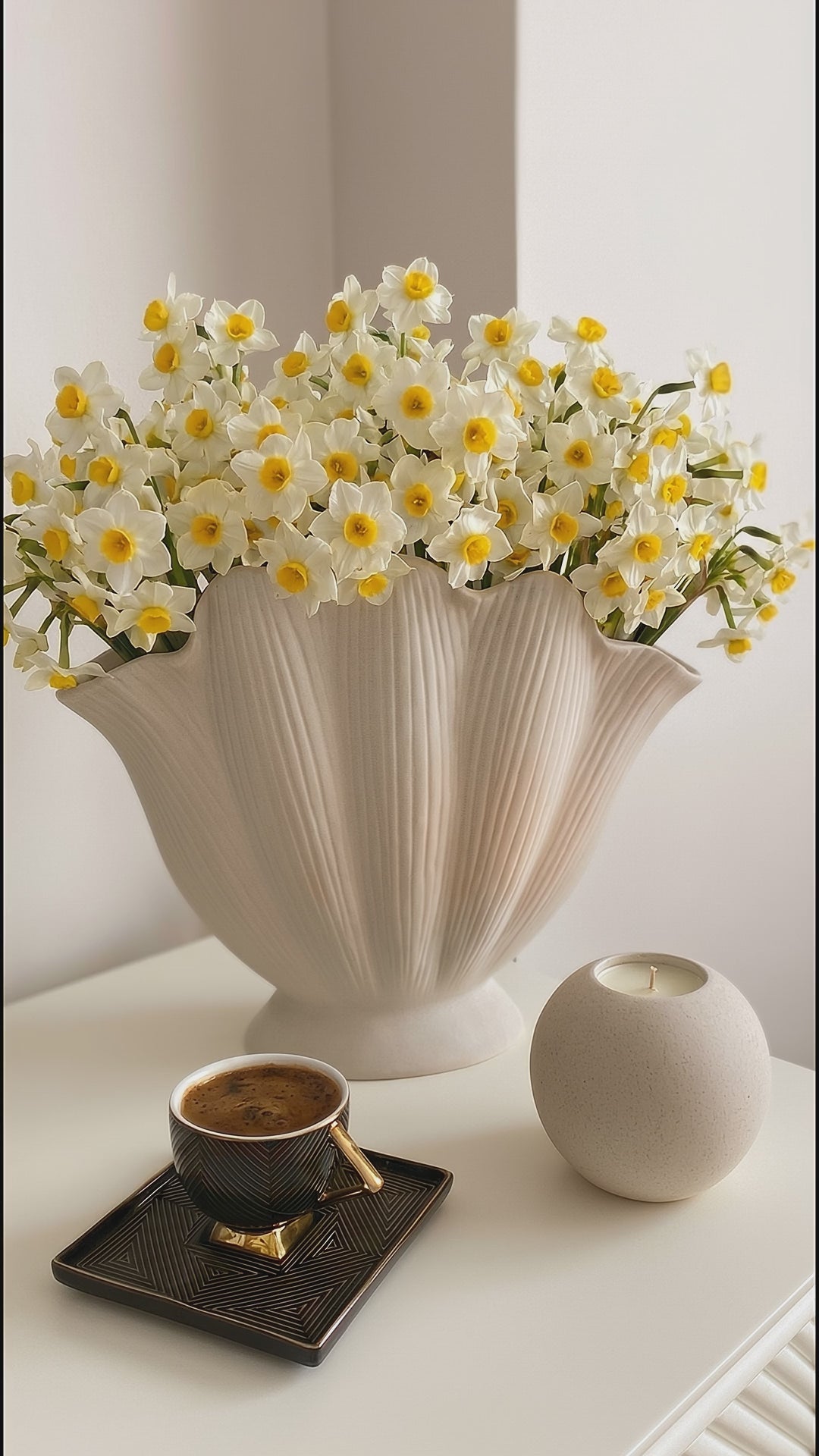 handmade white ceramic vase with sculptural seashell design for modern interiors