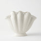 modern white ceramic decorative vases styled on a console table